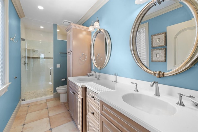 full bathroom featuring toilet, a shower stall, double vanity, and a sink