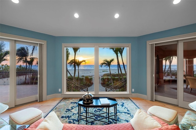 doorway to outside with light tile patterned floors, recessed lighting, and baseboards