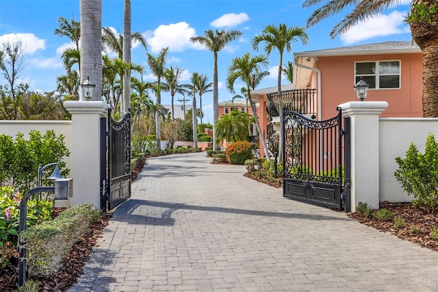 view of gate featuring fence