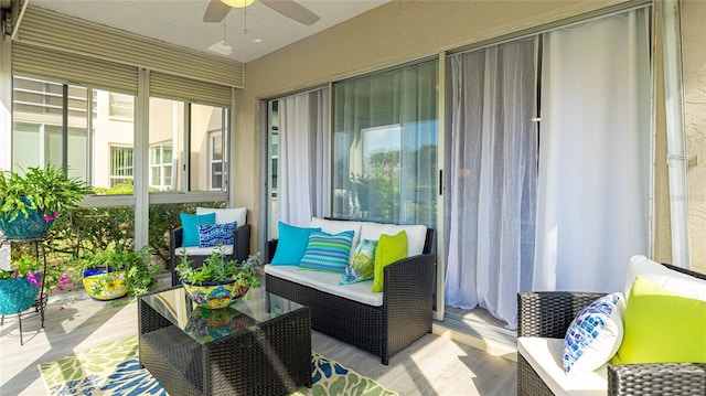 sunroom with ceiling fan