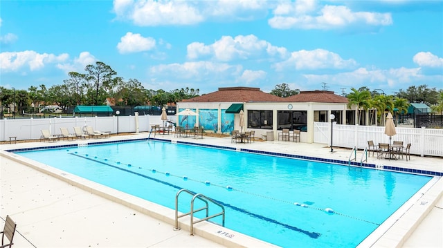 view of swimming pool featuring a patio area