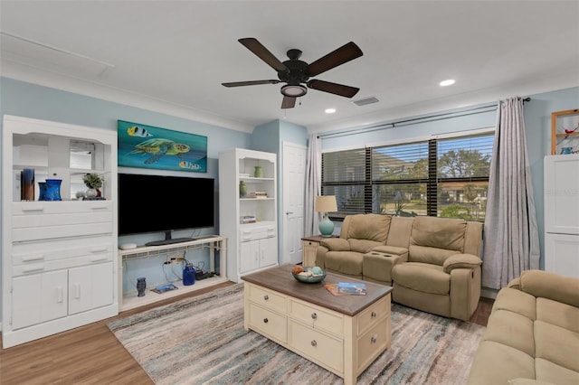 living room featuring ceiling fan and light hardwood / wood-style floors