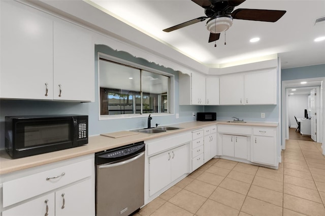 kitchen featuring sink, white cabinetry, light tile patterned floors, stainless steel dishwasher, and ceiling fan