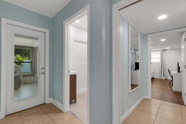 hallway with light tile patterned floors