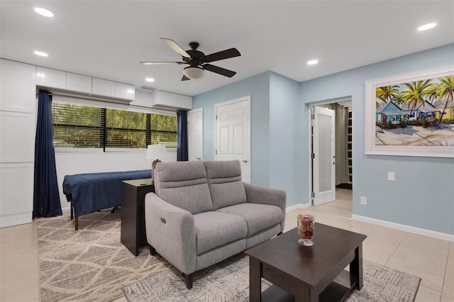 living room featuring light tile patterned floors and ceiling fan