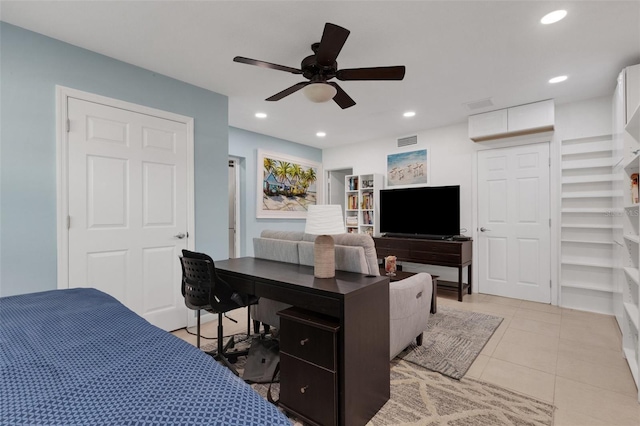 tiled bedroom featuring ceiling fan