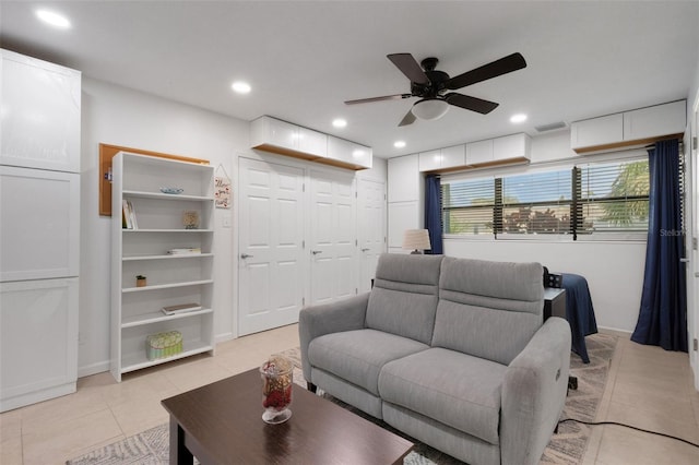 tiled living room with ceiling fan