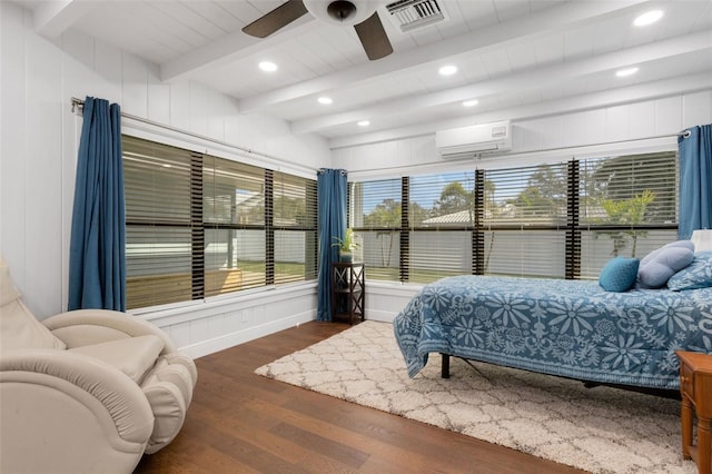 bedroom with ceiling fan, dark hardwood / wood-style flooring, a wall mounted AC, and beam ceiling