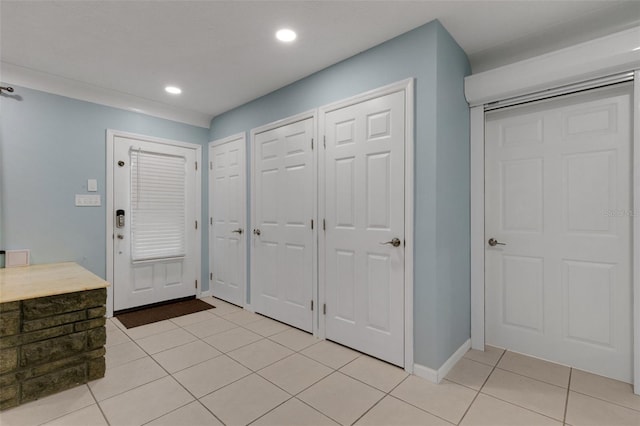 entrance foyer featuring light tile patterned flooring