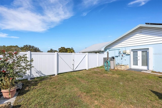 view of yard featuring french doors