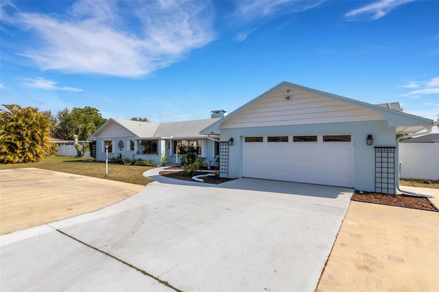 single story home featuring a garage and a front yard