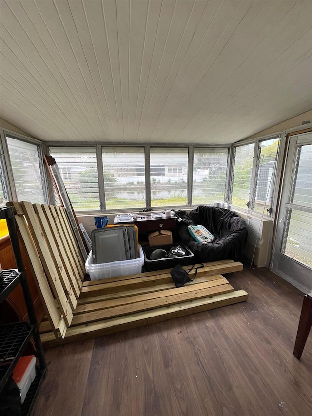 sunroom / solarium with a healthy amount of sunlight and wooden ceiling