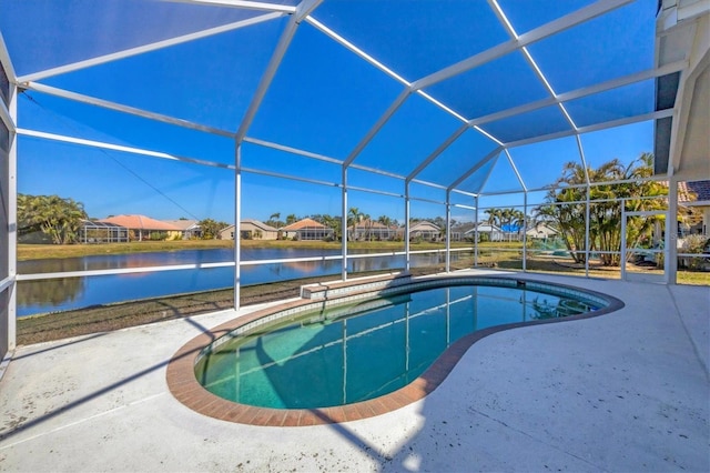 view of pool with a water view, a lanai, and a patio area