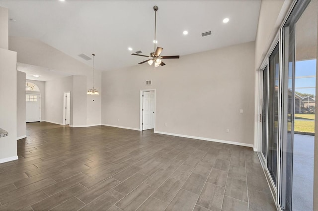 spare room featuring dark wood-type flooring, ceiling fan, and lofted ceiling