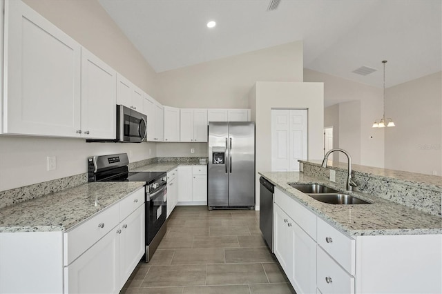 kitchen with sink, hanging light fixtures, stainless steel appliances, light stone countertops, and white cabinets