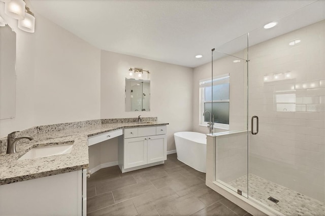 bathroom with vanity, shower with separate bathtub, and tile patterned floors