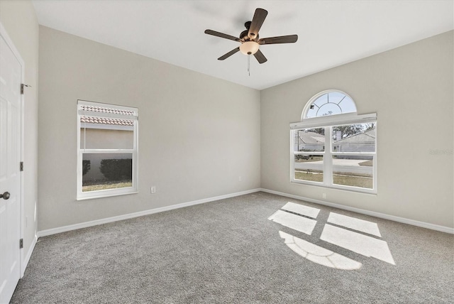 carpeted empty room with ceiling fan