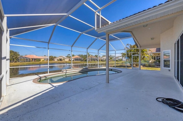 view of pool with a water view, a patio, and a lanai