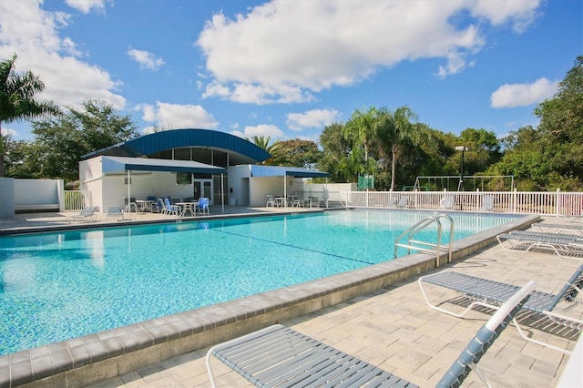 view of pool featuring a patio