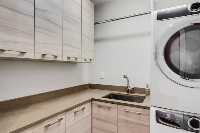 kitchen with stacked washing maching and dryer, sink, and light brown cabinetry