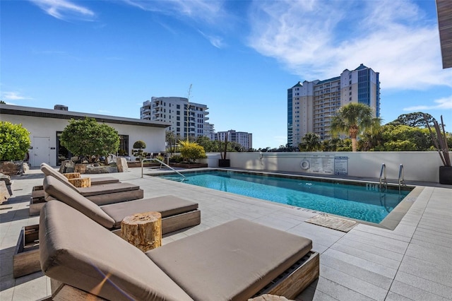 view of pool featuring a patio