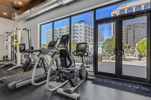 gym featuring french doors and wood ceiling