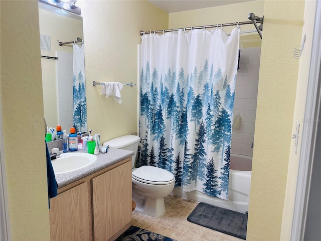 full bathroom with tile patterned floors, vanity, toilet, and shower / tub combo