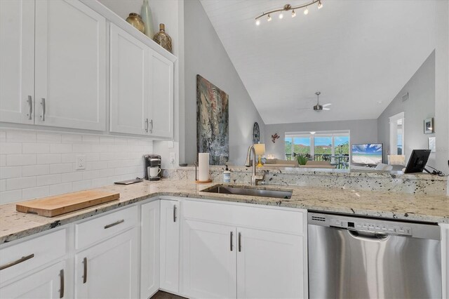 kitchen featuring white cabinetry, dishwasher, sink, and tasteful backsplash