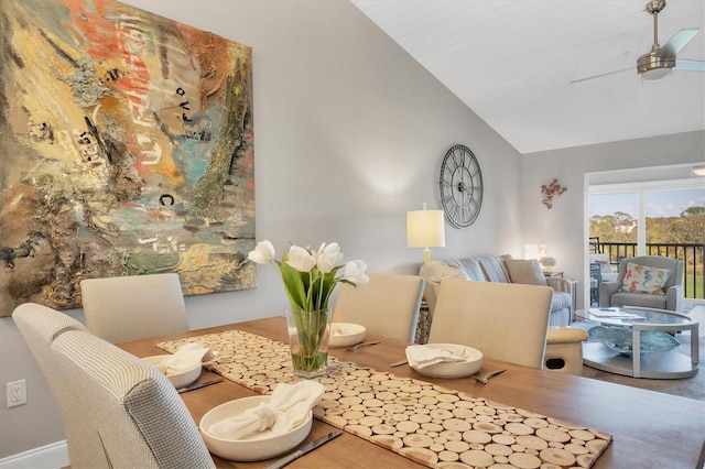 dining space with high vaulted ceiling and ceiling fan