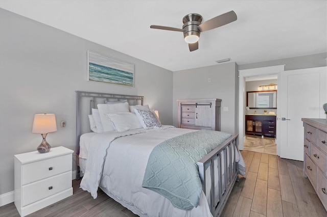 bedroom with hardwood / wood-style flooring and ceiling fan