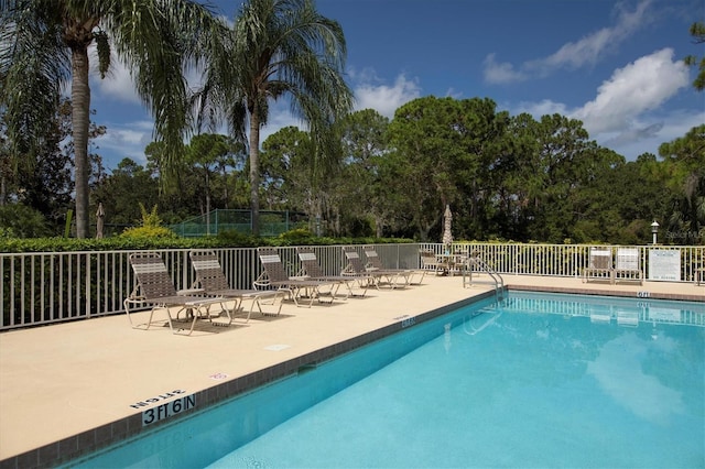 view of pool featuring a patio