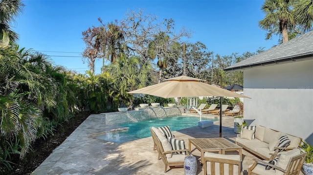 view of swimming pool with an outdoor hangout area, a patio, and pool water feature