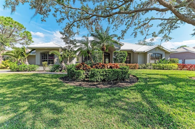 single story home with a front lawn