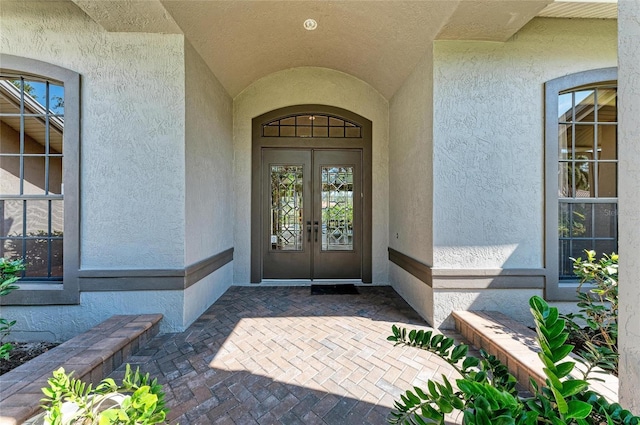 entrance to property featuring french doors