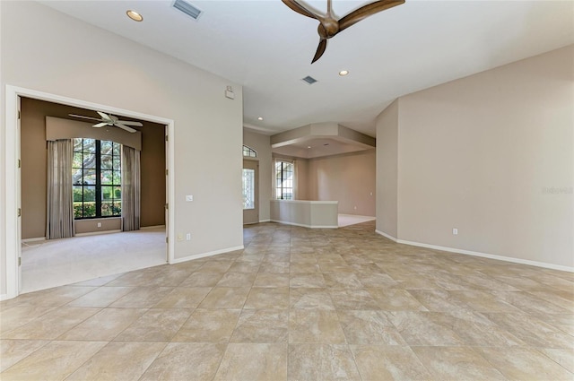 empty room with a healthy amount of sunlight and ceiling fan