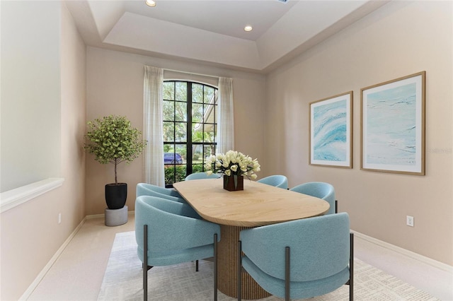 dining space featuring light colored carpet