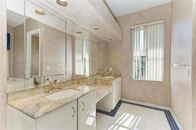 bathroom featuring vanity, tile patterned floors, and toilet