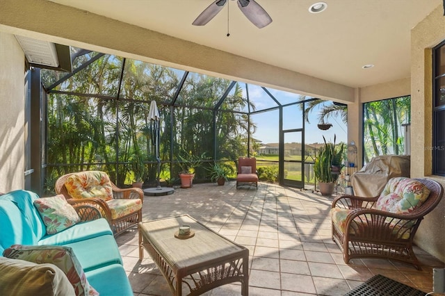 sunroom / solarium featuring ceiling fan