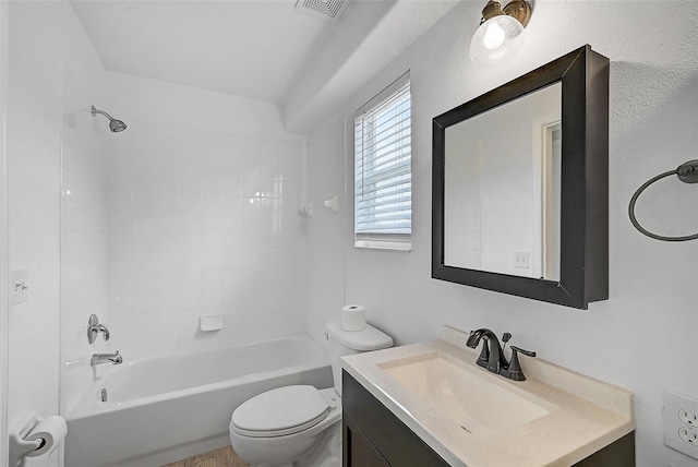 full bathroom featuring vanity, toilet, and tiled shower / bath combo