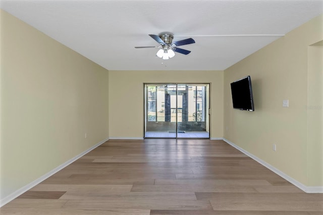 empty room with light hardwood / wood-style flooring and ceiling fan