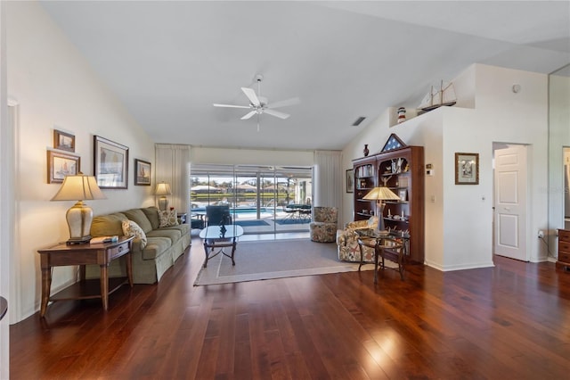 living room featuring ceiling fan, dark wood-type flooring, and high vaulted ceiling