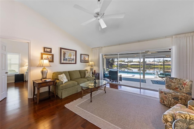 living room featuring plenty of natural light, dark hardwood / wood-style floors, high vaulted ceiling, and ceiling fan