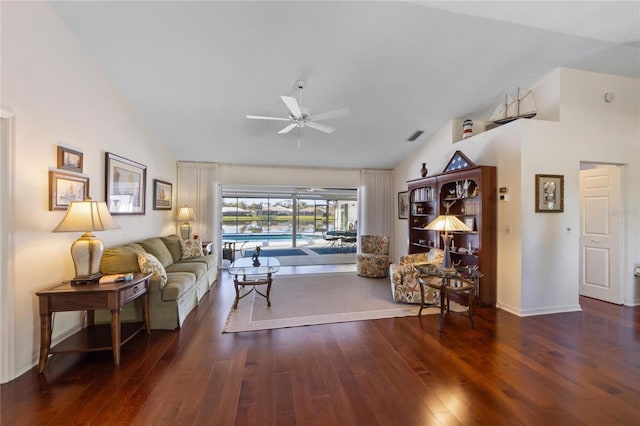 living room featuring ceiling fan, dark hardwood / wood-style floors, and high vaulted ceiling