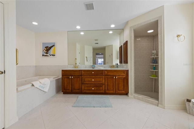 bathroom with independent shower and bath and vanity