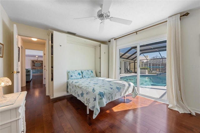 bedroom with dark hardwood / wood-style floors, access to exterior, and ceiling fan