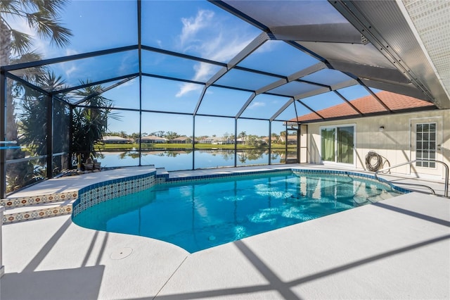 view of swimming pool with a water view, a patio, and a lanai