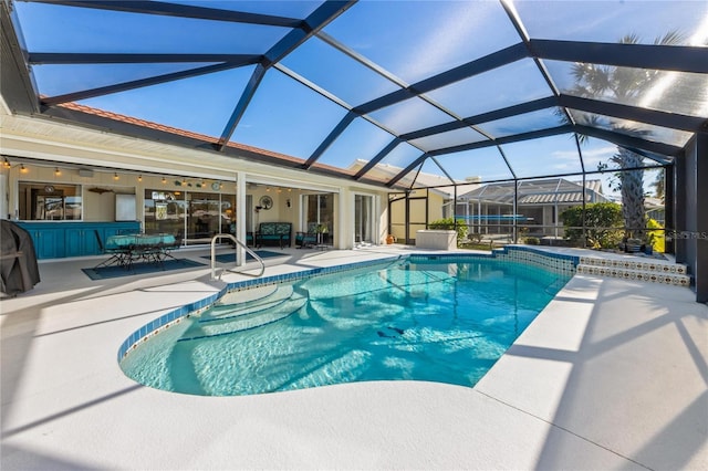 view of pool featuring a bar, a lanai, and a patio