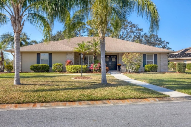 single story home with a front lawn