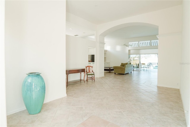 hall with light tile patterned floors