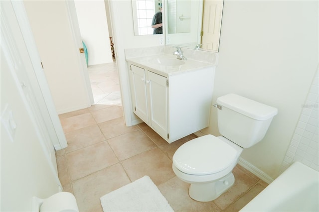 bathroom with vanity, tile patterned floors, and toilet